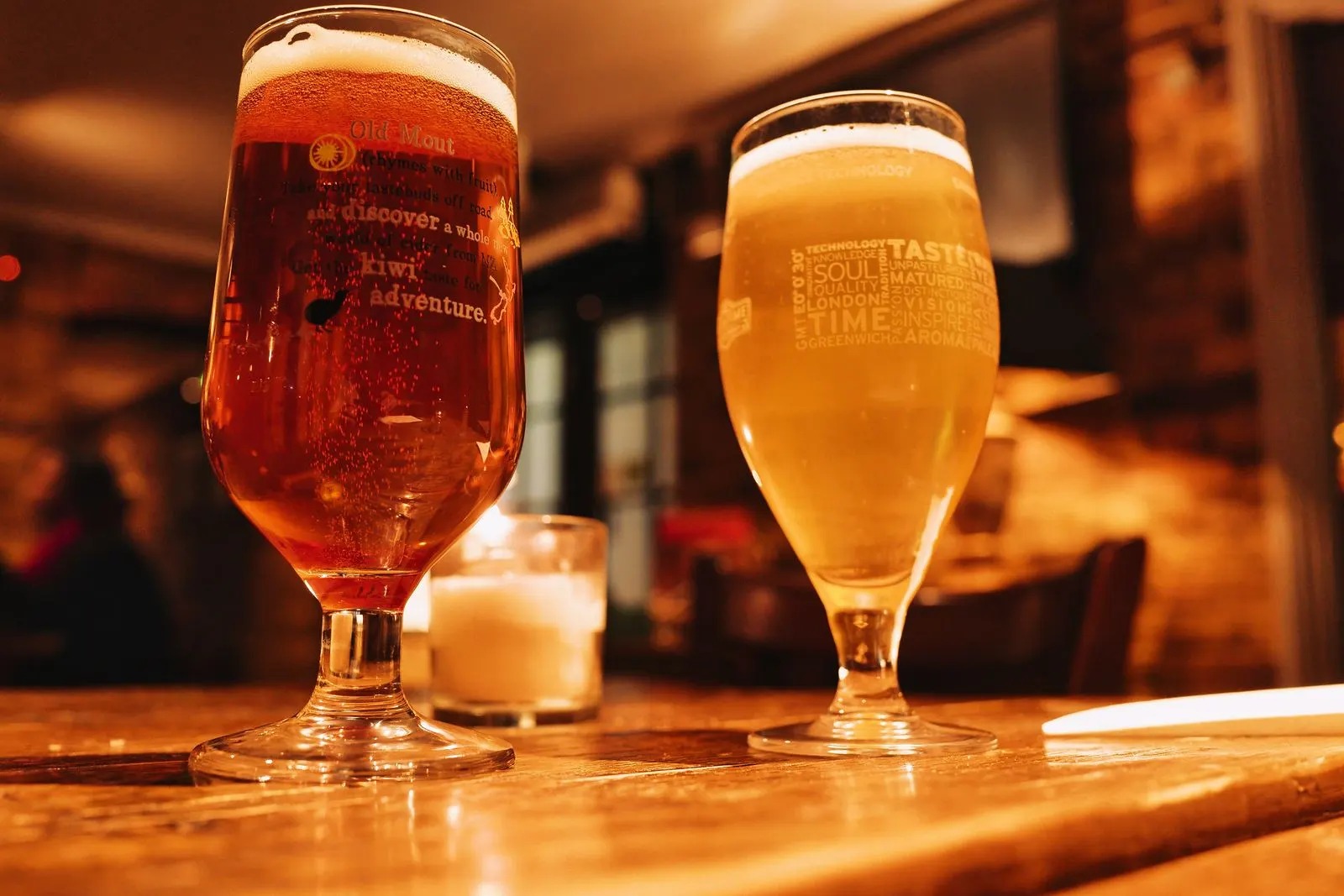 Two pints of beer on a pub table