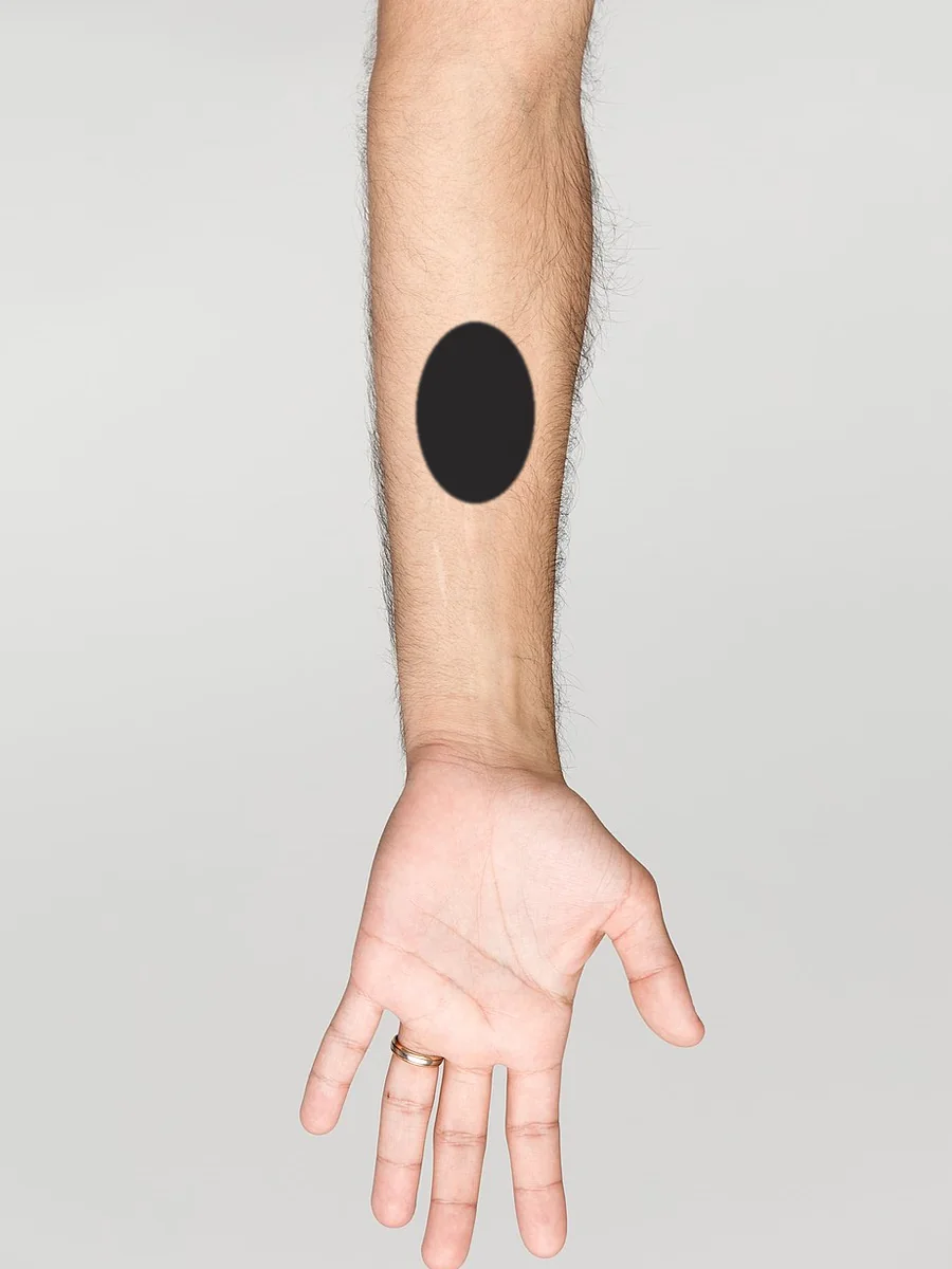 A small tattoo, about 5cm, on a forearm
