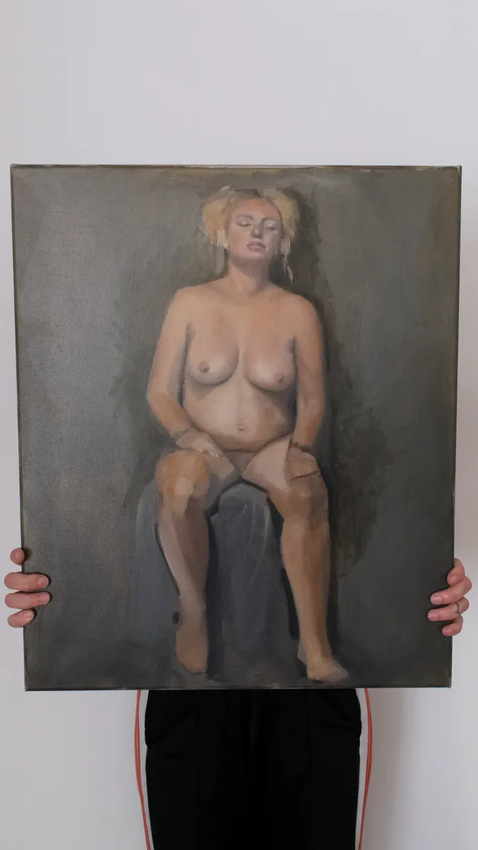 Oil figure painting of a seated nude, seen from the front, held up by Britt Beale